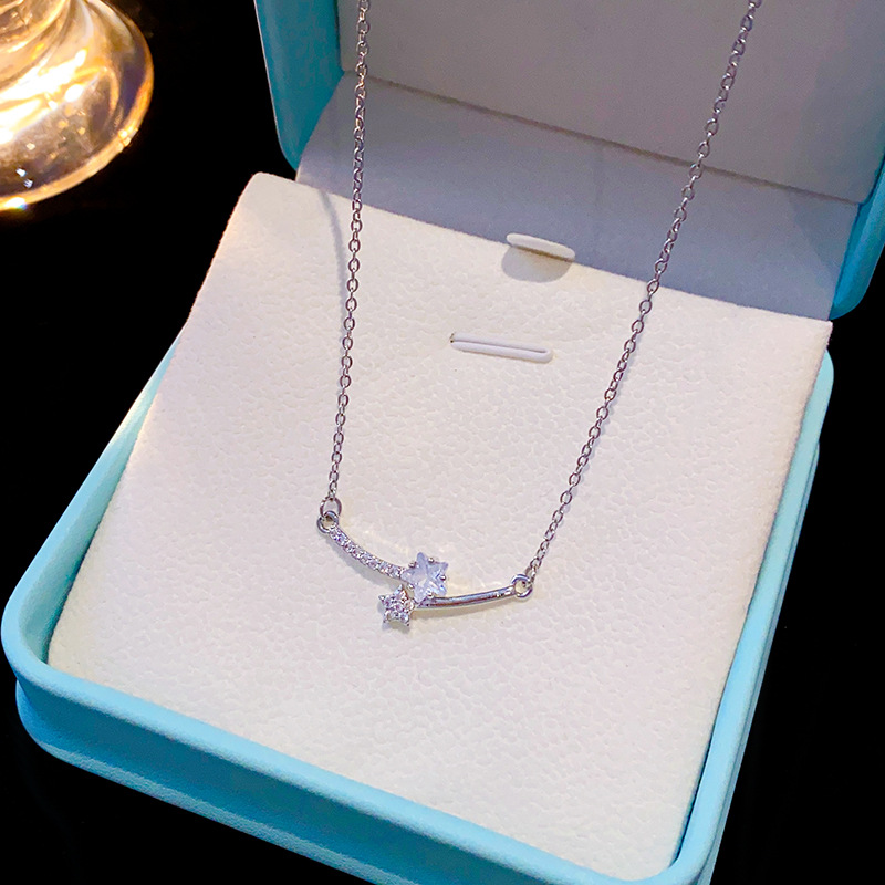 Silver simple micro-inlaid zircon star interlaced smile necklace, a rare titanium steel collarbone chain for women, a versatile accessory wholesale full figure