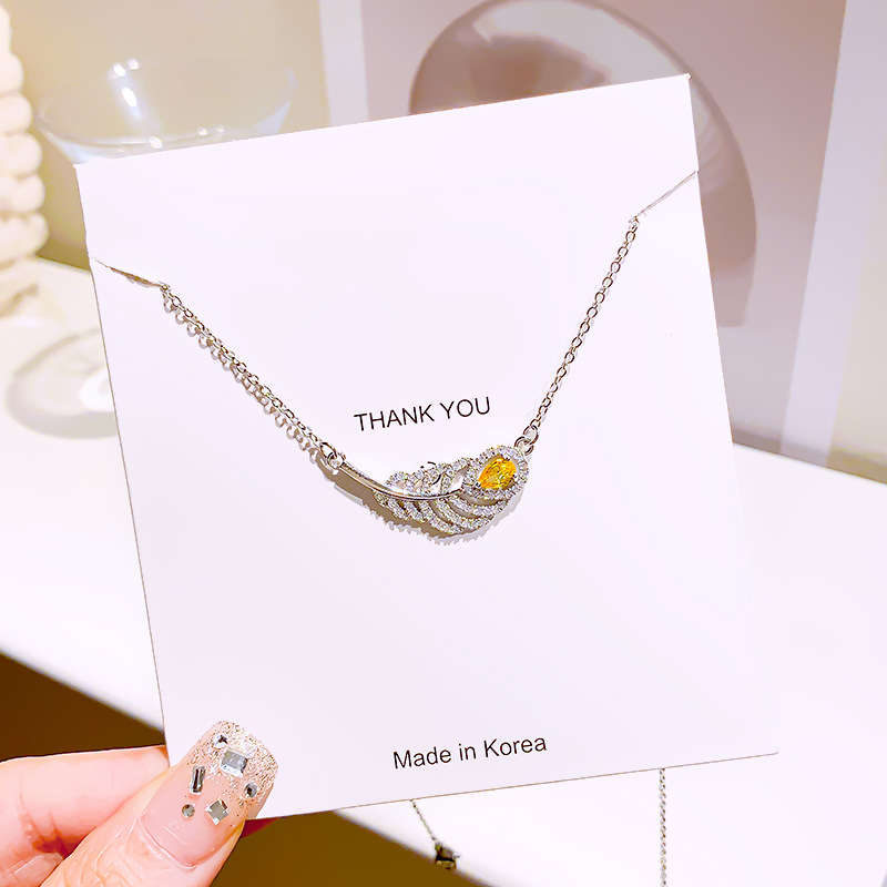 Titanium steel light luxury full diamond large feather necklace, women's niche design sense, elegant collarbone chain, high-end and versatile Internet celebrity accessory Application Scenario
