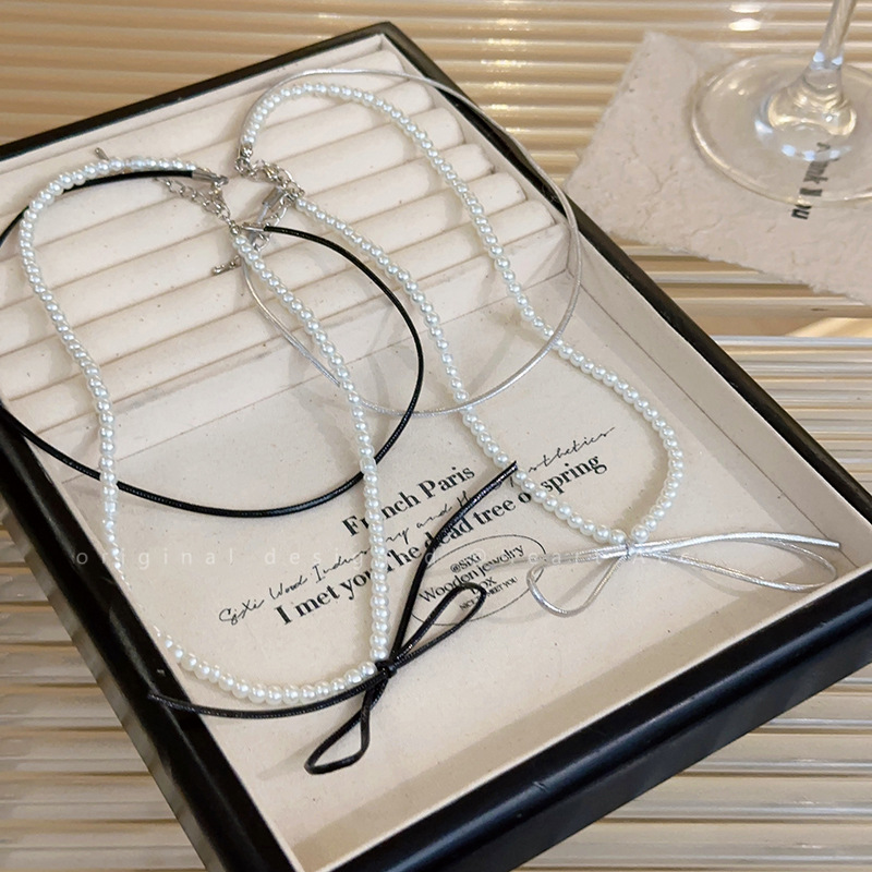 Double-layer stacked bow pearl necklace with a sweet and cool style and a niche design sense. Unique collarbone chain, a best-selling necklace wholesale Specification drawing