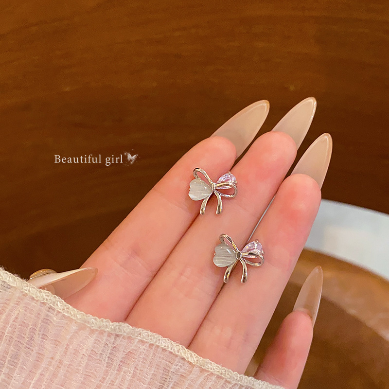 Korean-style sweet and elegant cat's eye stone bow stud earrings, women's fashionable and niche design sense, exquisite zircon earrings and earrings full figure