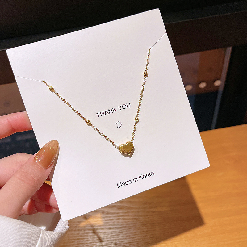 A simple Japanese and Korean bean-shaped heart-shaped necklace, a trendy and individualistic female Instagram-style collarbone chain that doesn't fade, made of titanium steel full figure