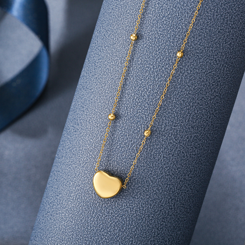 Golden niche heart-shaped necklace for women, non-fading, popular titanium steel small gold bead collarbone chain, simple smooth heart-shaped pendant Specification drawing
