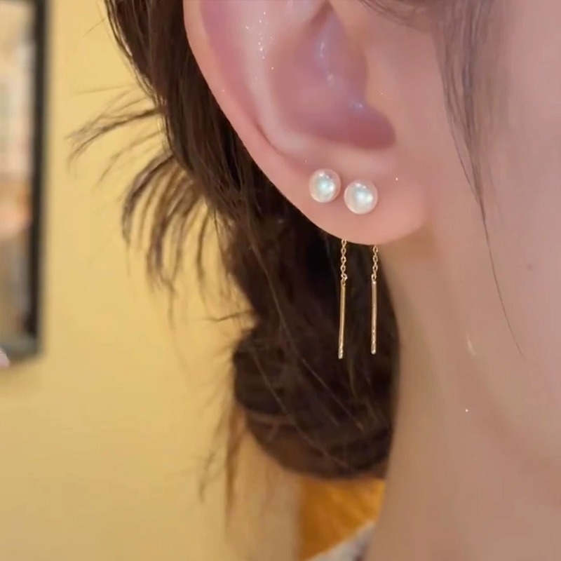 Wholesale of popular white beaded tassel ear strings on Douyin, fashionable, niche and light luxury earrings with a simple pearl style details Picture