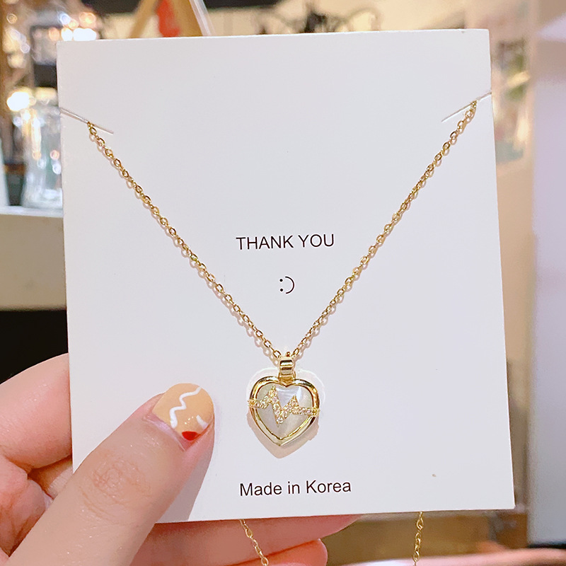 Fashionable and light luxury cat's eye stone heart-shaped titanium steel necklace, feminine zircon electrocardiogram pendant, Qixi Valentine's Day gift full figure