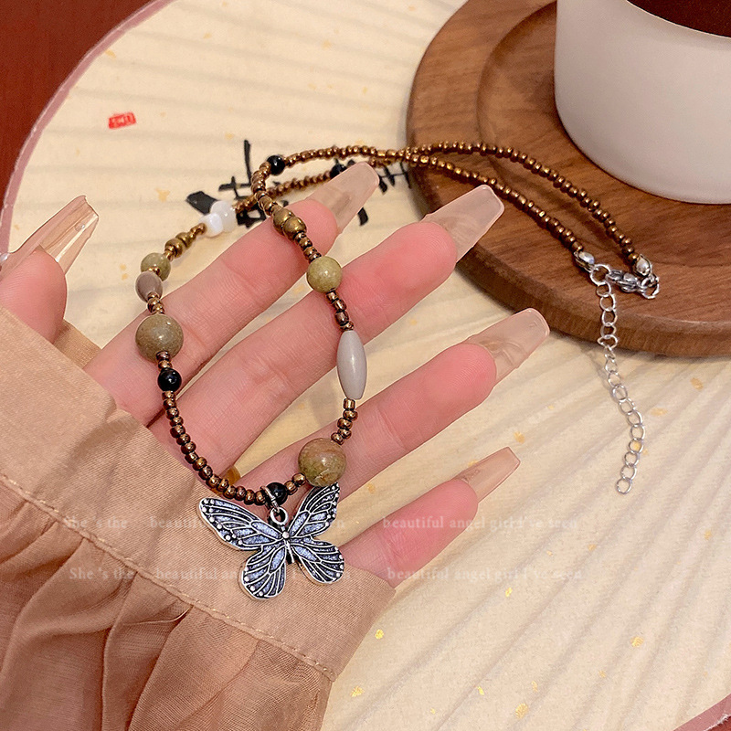 The new Chinese-style beaded butterfly necklace with wood and butterfly is a fashionable, retro and versatile necklace accessory for women. It features a niche design and a collarbone chain details Picture