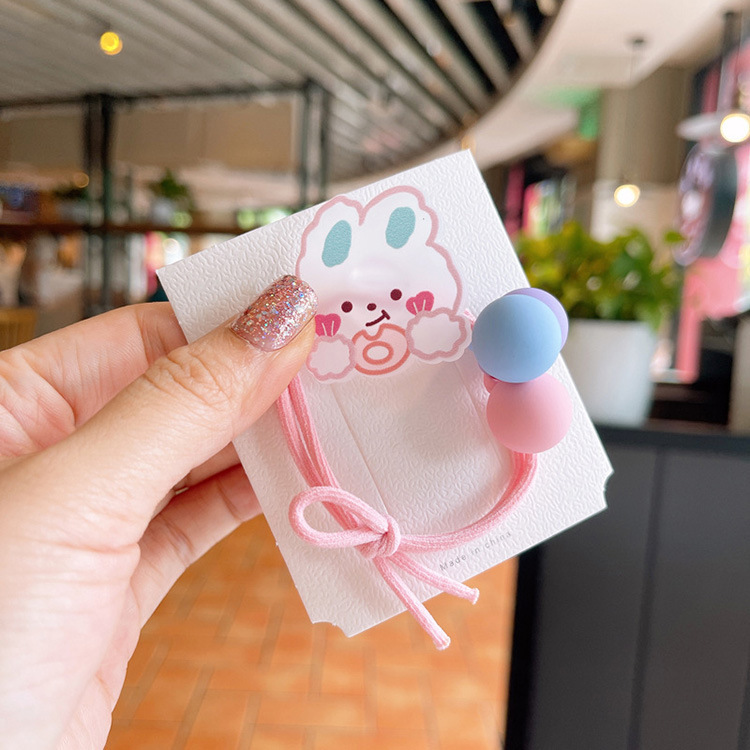 Korean cute cartoon hair ties, sweet and girlish graffiti flower hair ties, little girl tied up in a ponytail bun hair circle Application Scenario