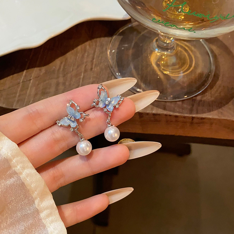 Blue butterfly tassel pearl earrings are trendy, versatile, high-end and elegant stud earrings for women on Instagram. They are popular earrings for young girls full figure