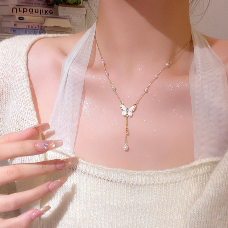 Glazed butterfly pearl tassel necklace for women, with a light luxury, niche and high-end feel. Titanium steel collarbone chain, fashionable and simple accessory details Picture
