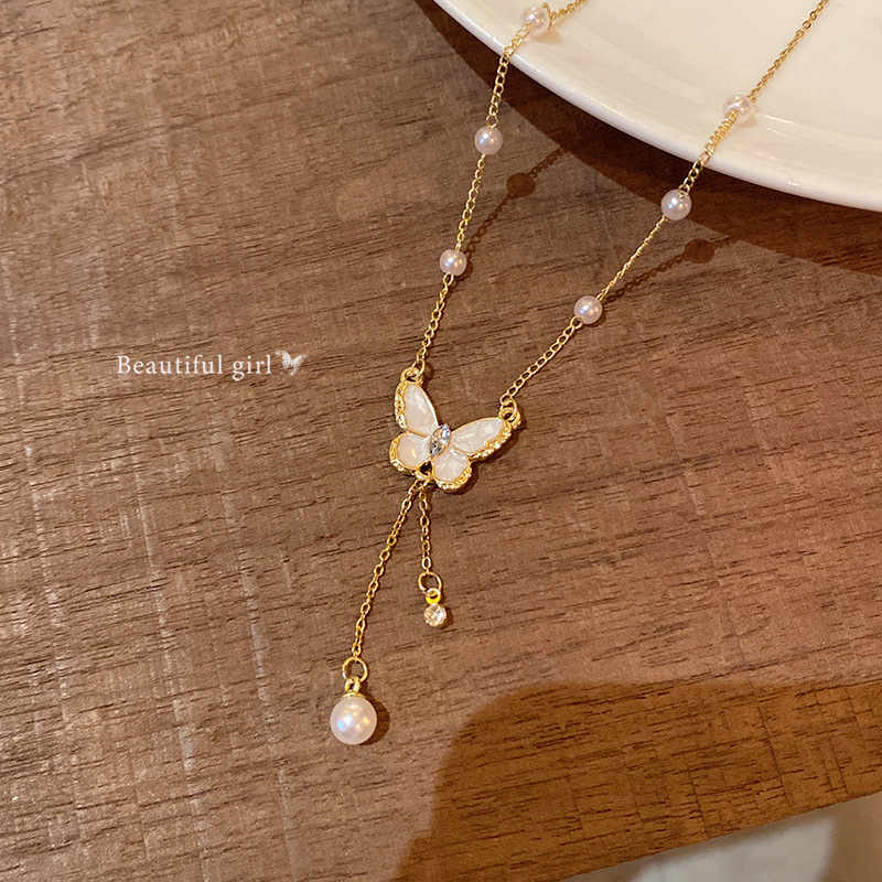 Glazed butterfly pearl tassel necklace for women, with a light luxury, niche and high-end feel. Titanium steel collarbone chain, fashionable and simple accessory Application Scenario