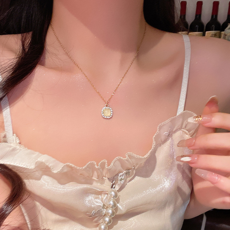 Light luxury cat's eye stone square pendant titanium steel necklace, high-end diamond-encrusted collarbone chain, elegant internet-famous sweater chain accessory full figure