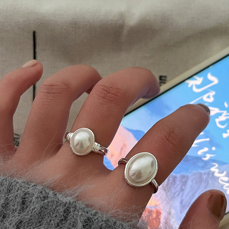 The new 2024 pearl ring for women features a light luxury and niche design. It exudes a sense of sophistication and is adjustable. It's a simple and trendy ring details Picture