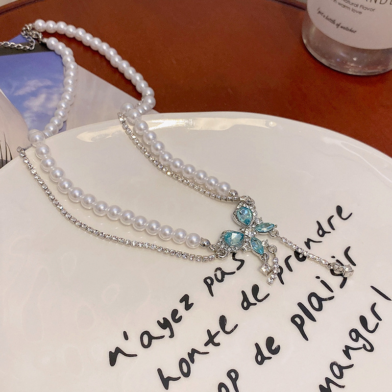 This ultra-ethereal and light luxury blue butterfly pearl necklace exudes a sense of high-end women. It features a double-layered diamond-encrusted tassel collarbone chain accessory Application Scenario