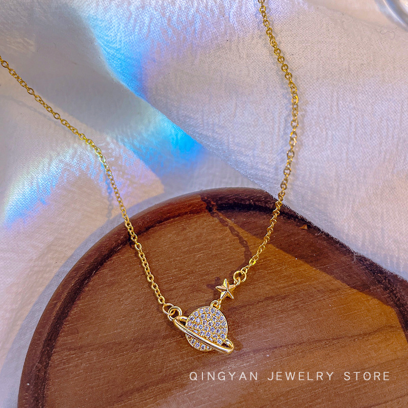 A popular and niche planetary pendant titanium steel necklace on Douyin, featuring a unique and trendy female InS-style collarbone chain accessory full figure