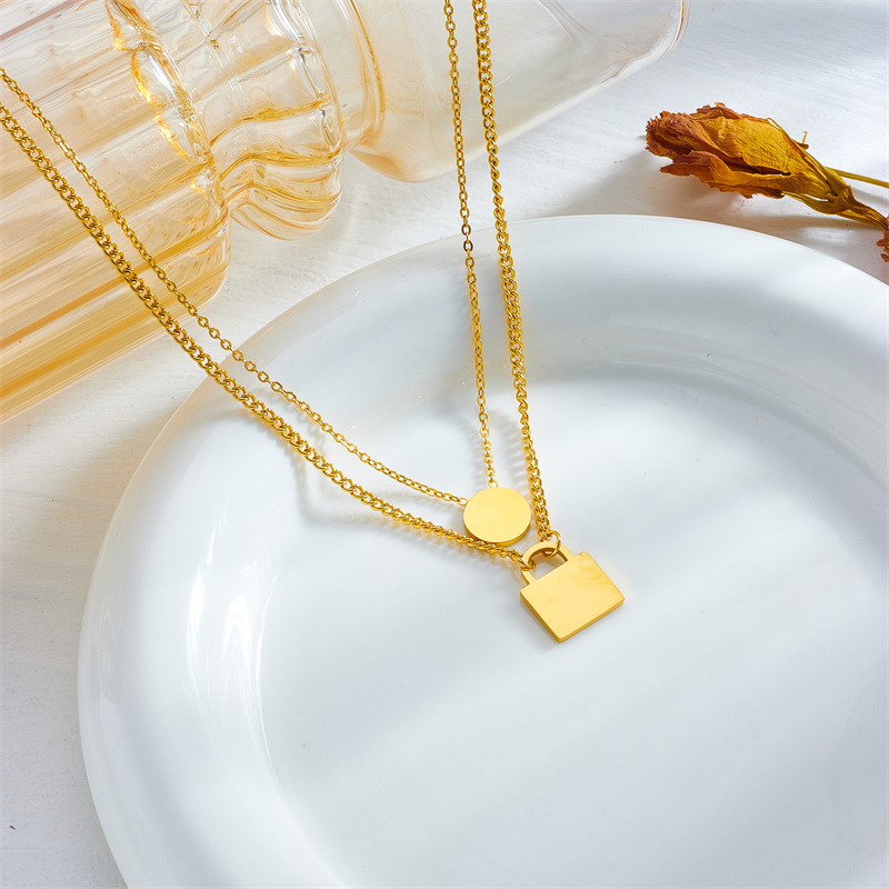 European and American fashion, niche design, simple and individual titanium steel oil drip lock head, round eye pendant, double-layer chain necklace details Picture