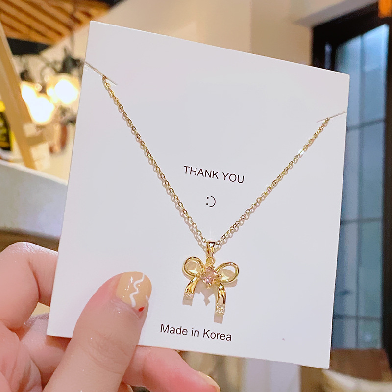 A light and luxurious pink bow titanium steel necklace, a fashionable and niche design for women, a popular collarbone accessory with a high-end feel details Picture