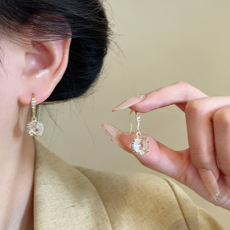 The Korean version of the sparkling diamond zircon earrings features a retro and versatile design for women. The new ear hooks exude a light luxury vibe and are a hit earpiece that has become a social media sensation details Picture