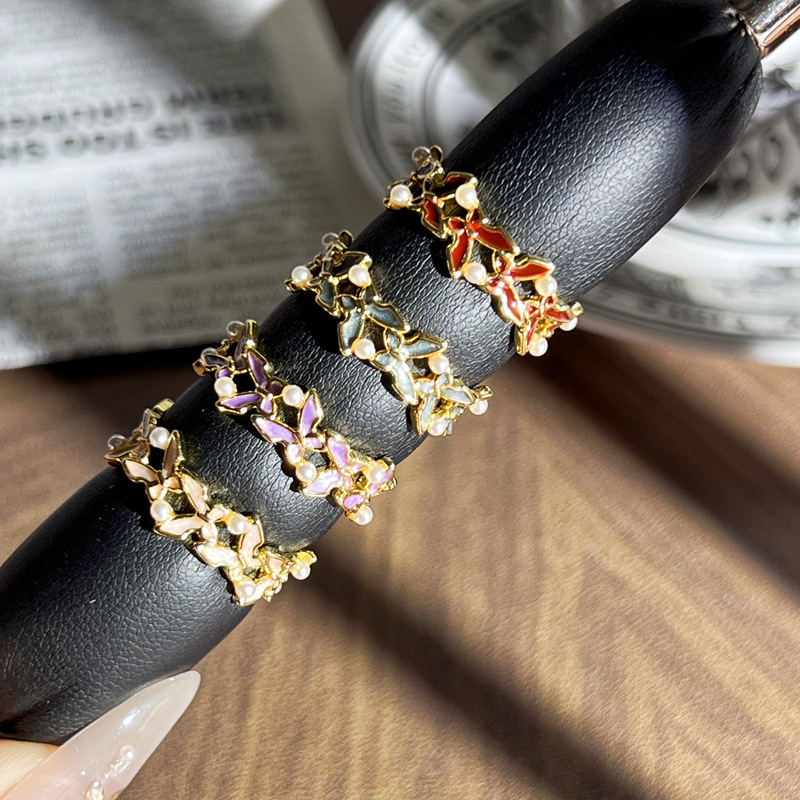 The ring is a retro, sweet and cool enamel ring with butterfly pearl inlay and an open ring. It is a rare and cold style versatile accessory Specification drawing