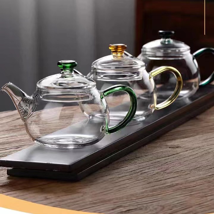 Wholesale household transparent high borosilicate glass brewing teapots, small single-person color handle brewing teapots with filtering function full figure