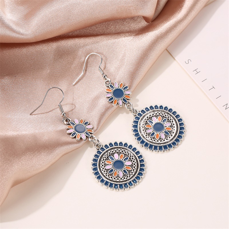 Ethnic-style colorful oil-dripping long small Daisy retro earrings, court-style carved alloy flower totem earrings Application Scenario
