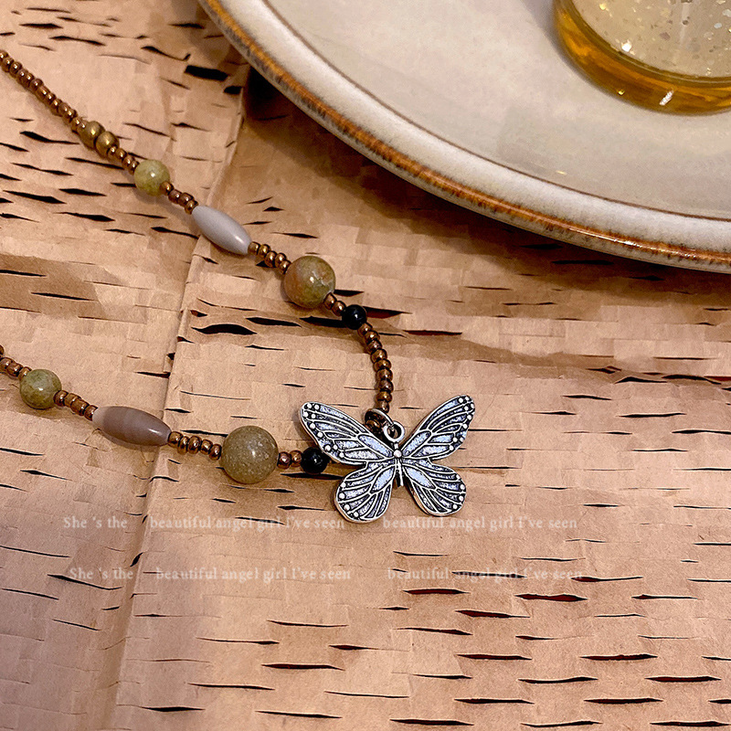 The new Chinese-style beaded butterfly necklace with wood and butterfly is a fashionable, retro and versatile necklace accessory for women. It features a niche design and a collarbone chain Application Scenario