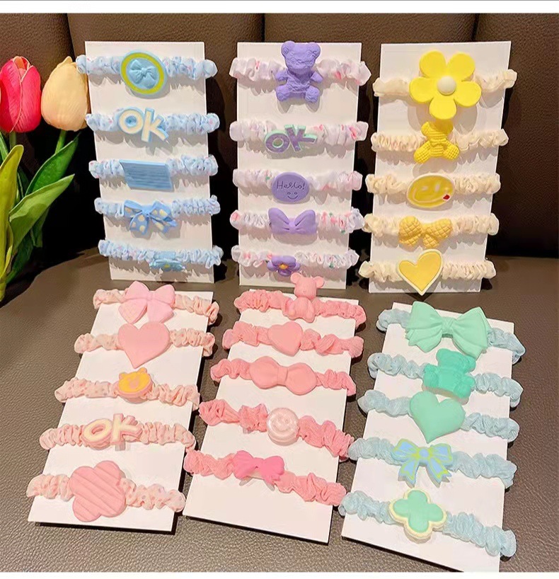 "Love Children's hair band, pleated fabric cartoon hair accessory, fresh and clean, high elasticity polka dot small intestine circle bun hair tie for girls. Application Scenario