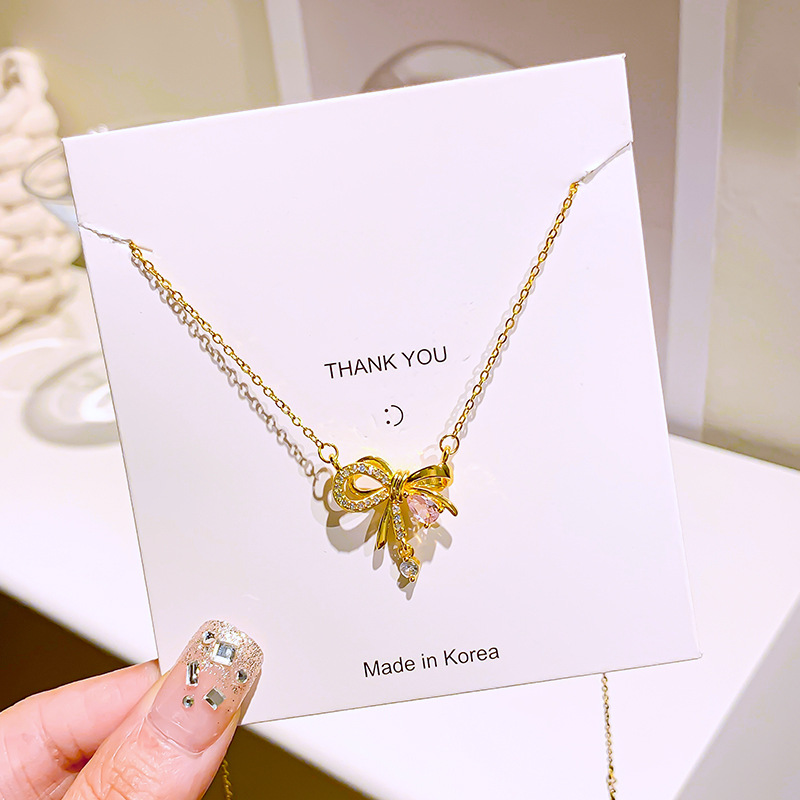 Korean-style golden pink diamond bow necklace, a niche design for women, a popular collarbone chain, a light luxury and versatile accessory Application Scenario