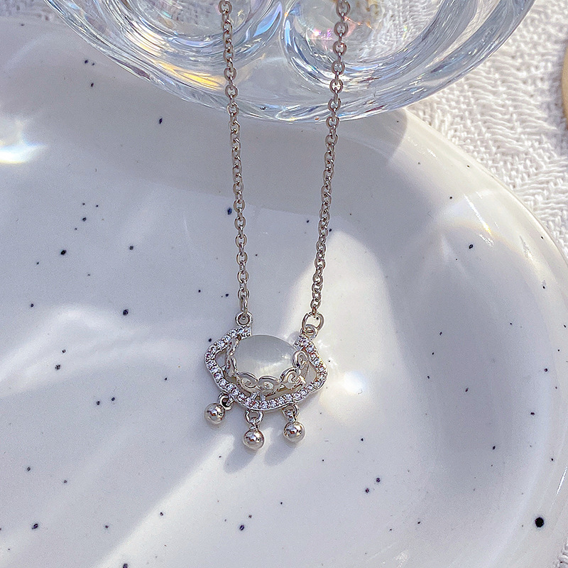 White K cat's eye stone longevity lock pendant titanium steel necklace with Japanese and Korean design sense, versatile for women, light luxury style diamond-encrusted collarbone chain Application Scenario