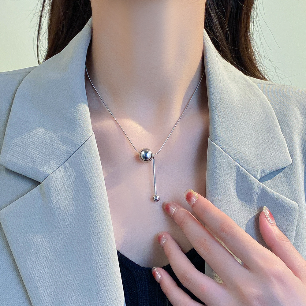 Minimalist ins metal round ball long sweater chain, non-fading titanium steel necklace, versatile tassel snake bone chain for women's personality details Picture