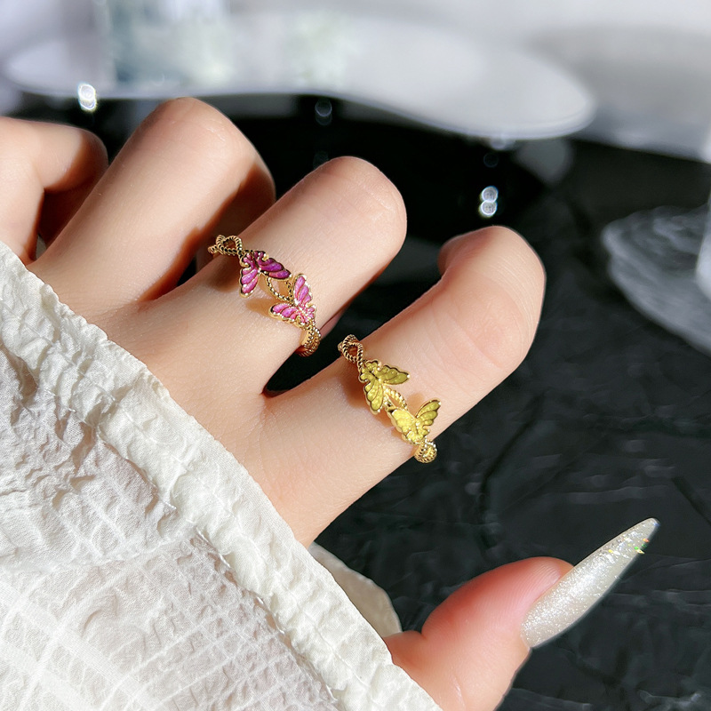 A golden double butterfly opening ring with a purple drip glaze for women, featuring a light luxury and niche design, is exquisite and sweet. It is a trendy ring accessory details Picture