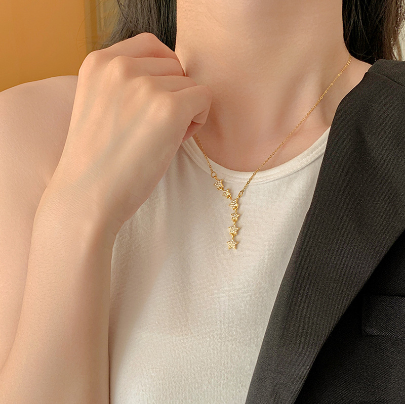 A fashionable and light luxury titanium steel necklace with a starry sky, featuring a niche design for women with tassels and star-shaped collarbone chains, is a trendy and elegant accessory details Picture