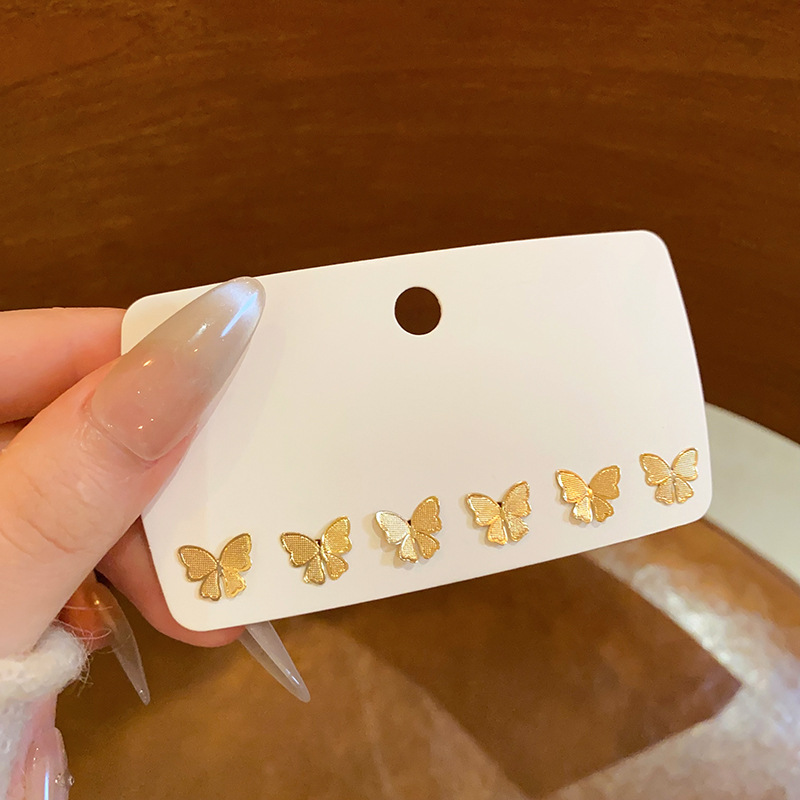 European and American ins style golden butterfly stud earrings for women, a light luxury, niche and high-end three-piece set of earrings, a best-selling ear accessory full figure