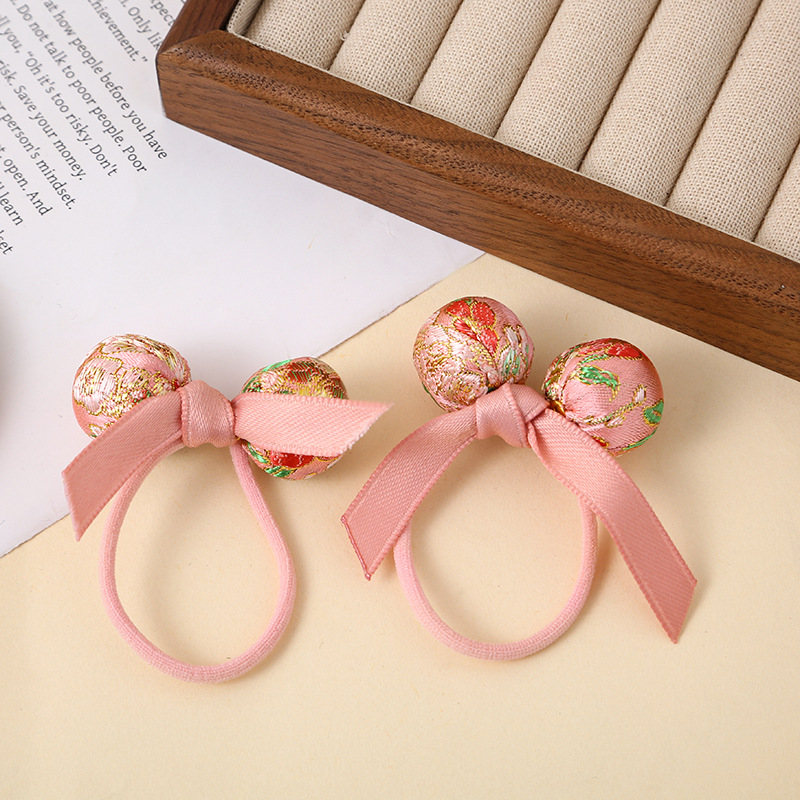Wholesale red New Year satin lace matching children and girls' hair bands, Chinese-style hair ties, and festive bun hair ties Application Scenario