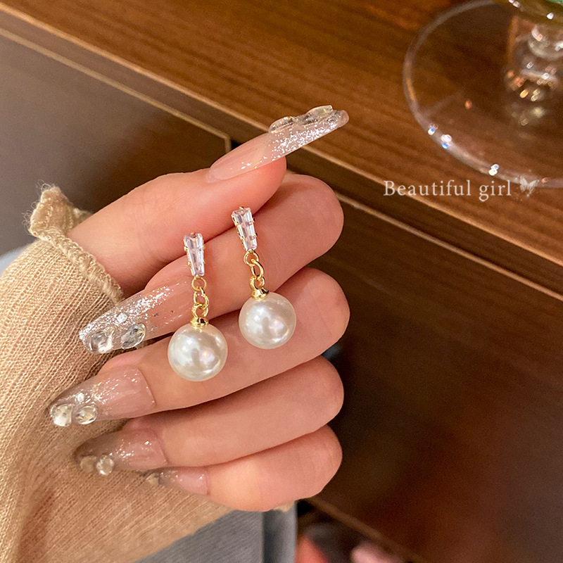 S925 Silver Needle Exquisite Zircon tassel pearl stud earrings are versatile for women, exuding a sense of high-end luxury and a light luxury style. Wholesale of best-selling earrings full figure