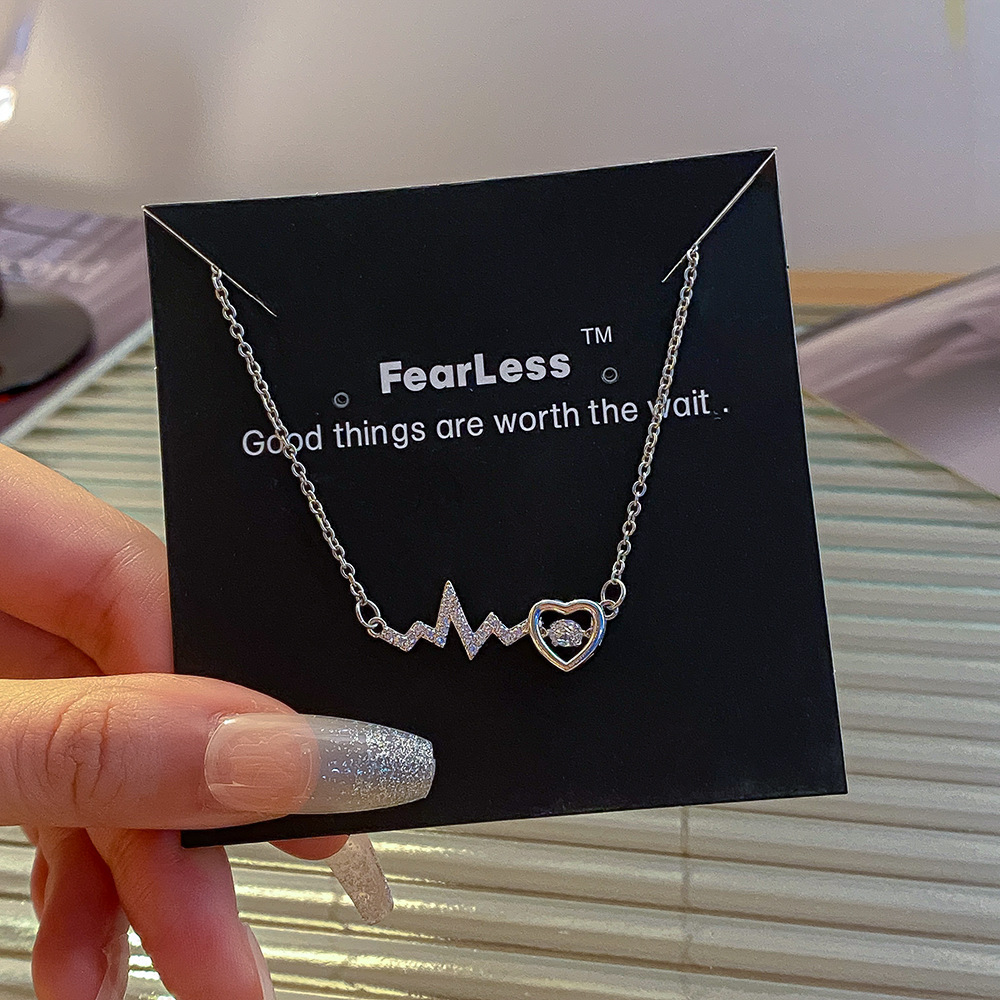 A light luxury style simple electrocardiogram heart-shaped dynamic necklace for women's fashion, a versatile titanium steel collarbone chain, a niche and elegant accessory Application Scenario