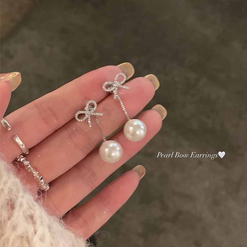 Autumn and winter collection of rear-hanging zirconium butterfly tassel earrings with a unique, light luxury and high-end look for women. Wholesale of pearl stud earrings details Picture