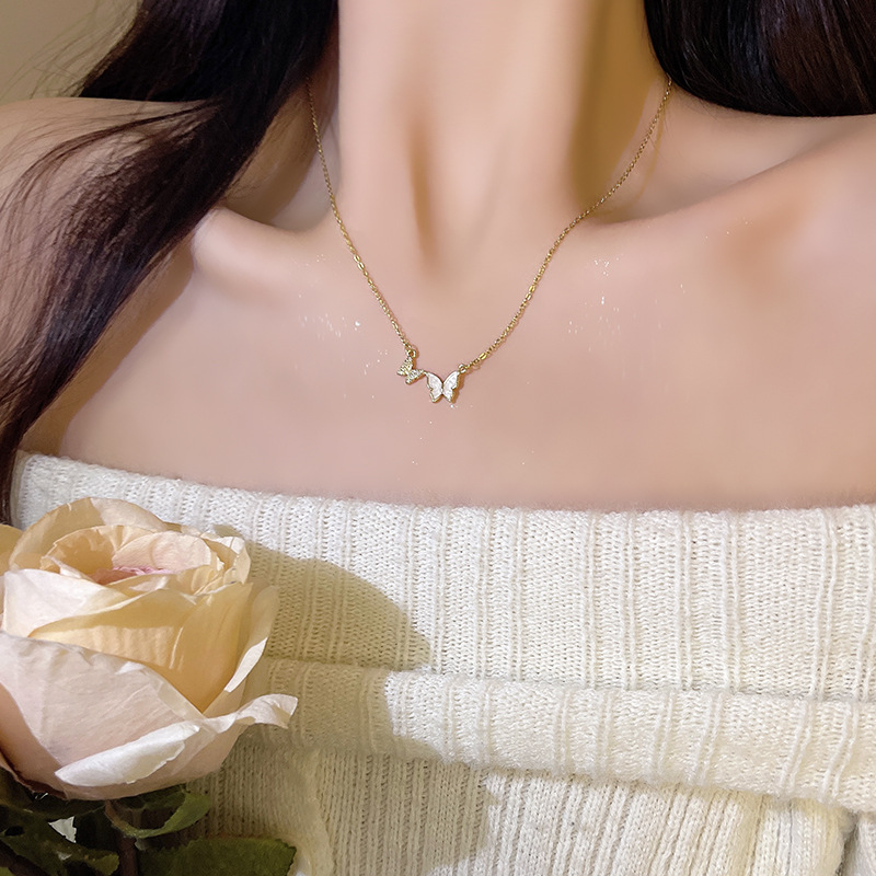 Exquisite micro-inlaid butterfly titanium steel necklace for women, in an inS-style, light luxury, versatile, niche and high-end look, a popular collarbone chain accessory Application Scenario
