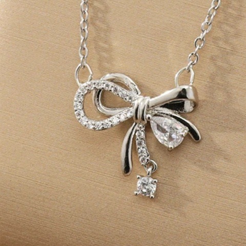 New women's necklace with micro-inlaid zircon bow water drop necklace, Japanese and Korean style niche design collarbone chain accessory wholesale Application Scenario
