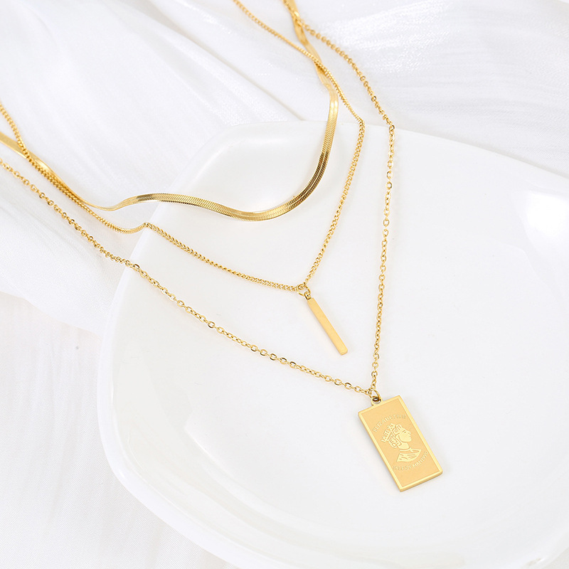 An irregular, simple and versatile titanium steel pendant necklace featuring a long and square queen's head in European and American fashion Application Scenario