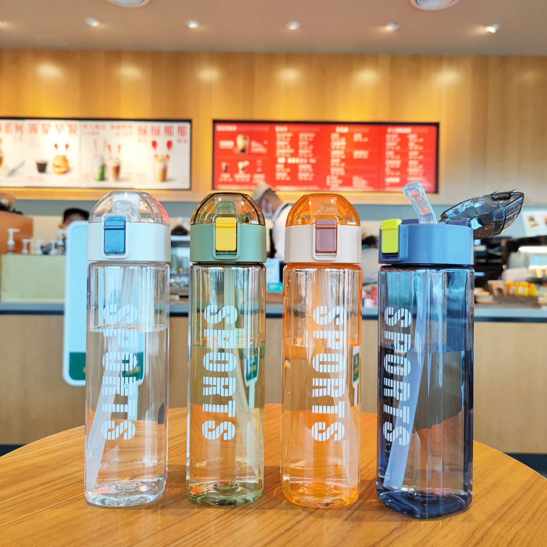 Creative new square sports and fitness water bottle, portable silicone handle, spout, straw, plastic water cup with lock Application Scenario