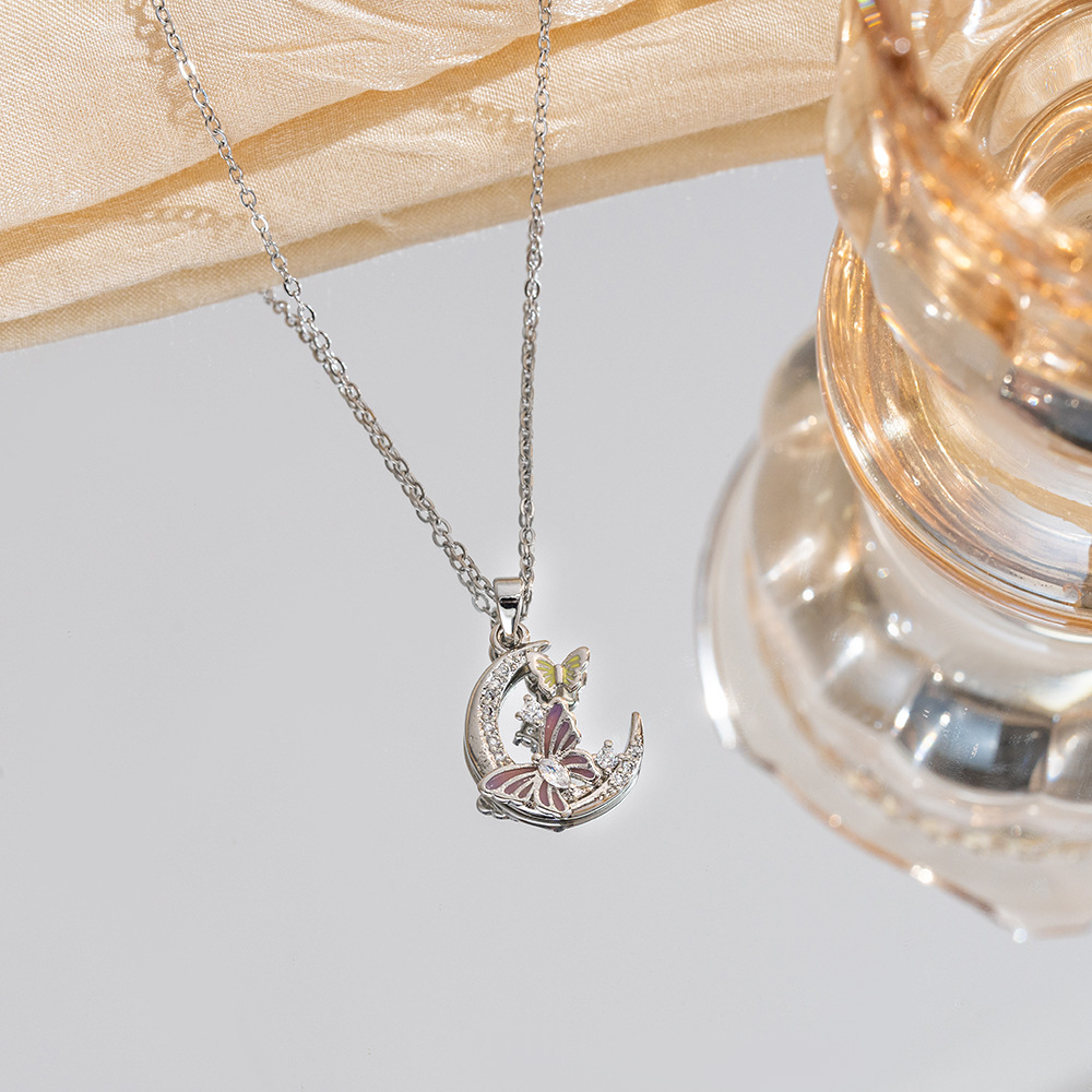 A new innovative design dual-color moon butterfly pendant titanium steel necklace with a feminine, light luxury style and a niche collarbone chain Application Scenario