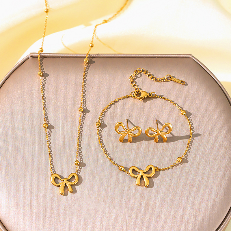 Titanium steel simple bean chain bow necklace, women's bracelet and stud three-piece set, non-fading, elegant and light luxury collarbone chain full figure
