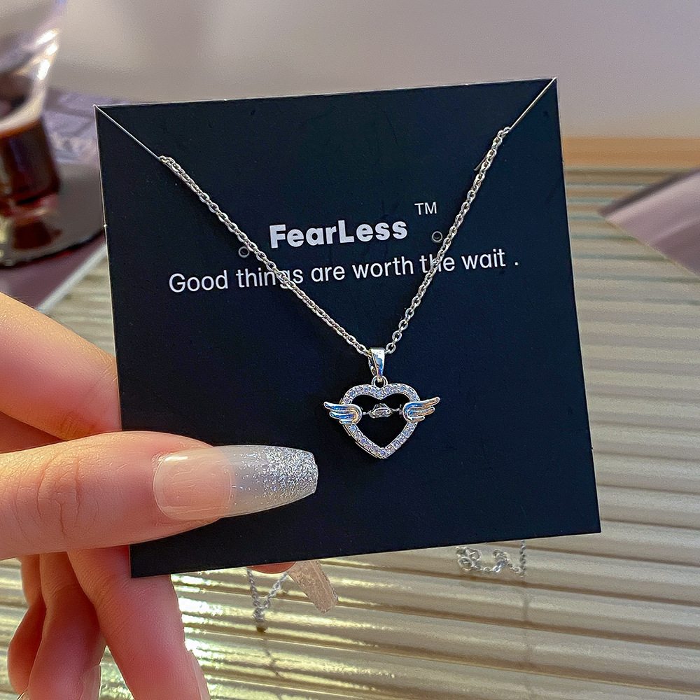 Silver light luxury and dynamic heart-shaped wing necklace for women, exquisitely inlaid zircon titanium steel collarbone chain, stylish and trendy accessory Application Scenario