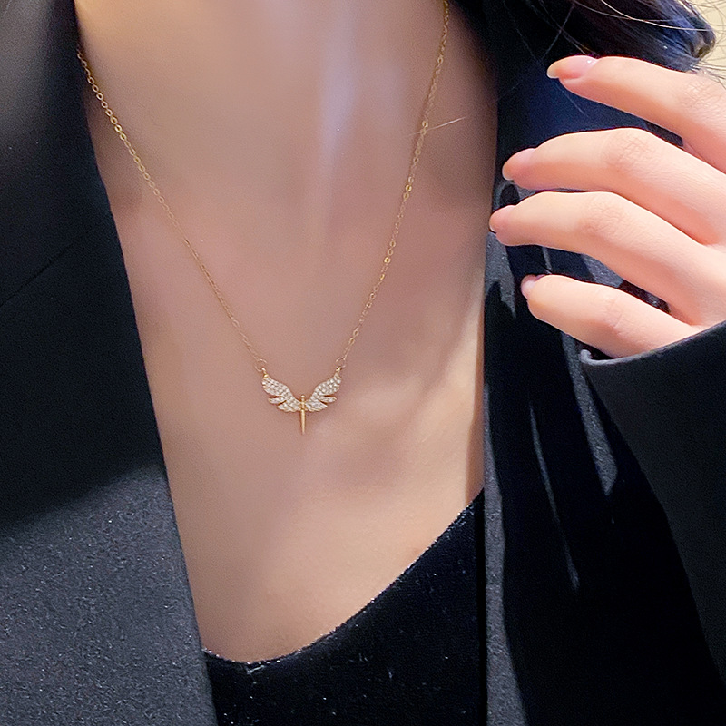 Genuine gold electroplated full diamond wing holy sword pendant titanium steel necklace, women's niche fashion design sense, versatile accessory wholesale Application Scenario