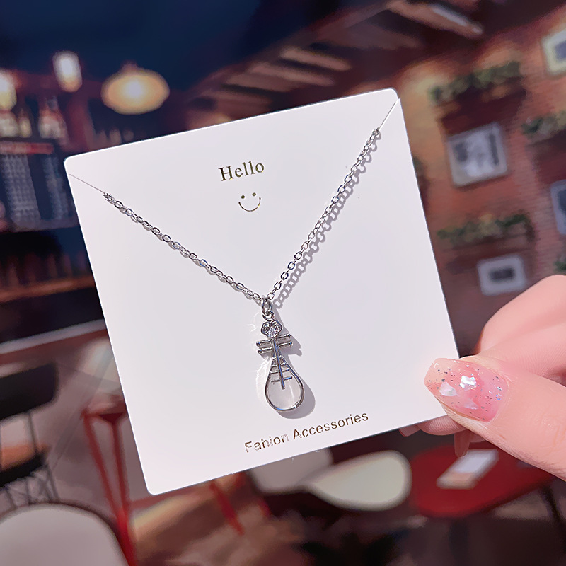 A simple silver cat's eye stone pipa pendant titanium steel necklace from Japan and South Korea, a high-end and niche female collarbone chain accessory Application Scenario