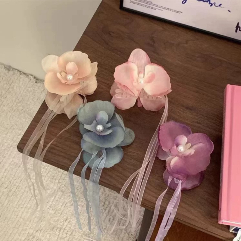 The super fairy-like Phalaenopsis flower ribbon hairpin for women's travel atmosphere, a new hair accessory for 2024 details Picture