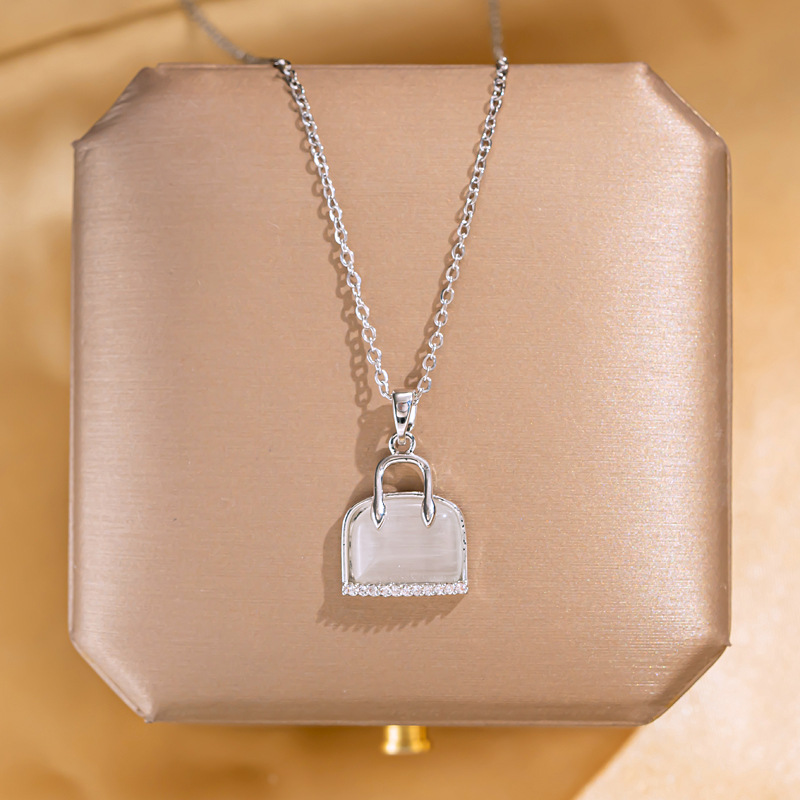 New Korean version silver cat's eye stone bag necklace, women's niche design sense, full diamond pendant, elegant and versatile collarbone chain full figure
