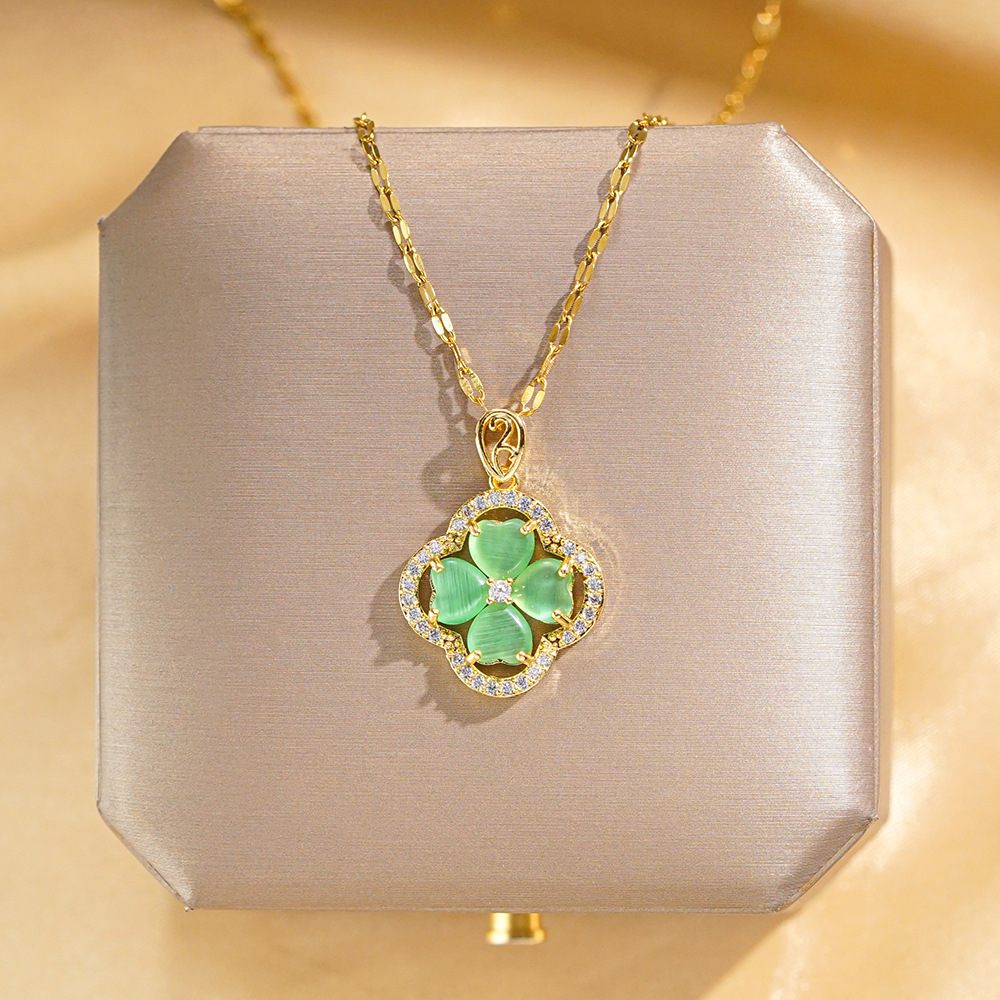 Fashionable and light luxury green cat's eye stone four-leaf clover full diamond titanium steel necklace, women's luxury and versatile collarbone chain, wholesale full figure