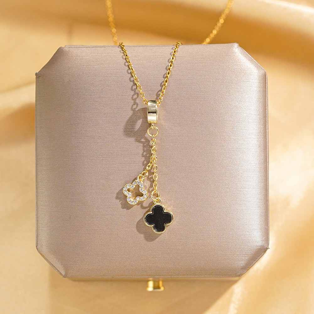 Fashionable diamond-encrusted gold-plated tassel four-leaf clover pendant titanium steel necklace, a unique and versatile collarbone chain accessory for women full figure