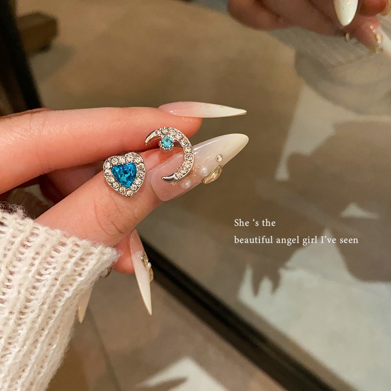 Wholesale of sea blue heart-shaped zircon ear stud earrings with a cold and elegant feminine style, exquisite micro-inset moon ear stud earrings, and a versatile and personalized accessory full figure