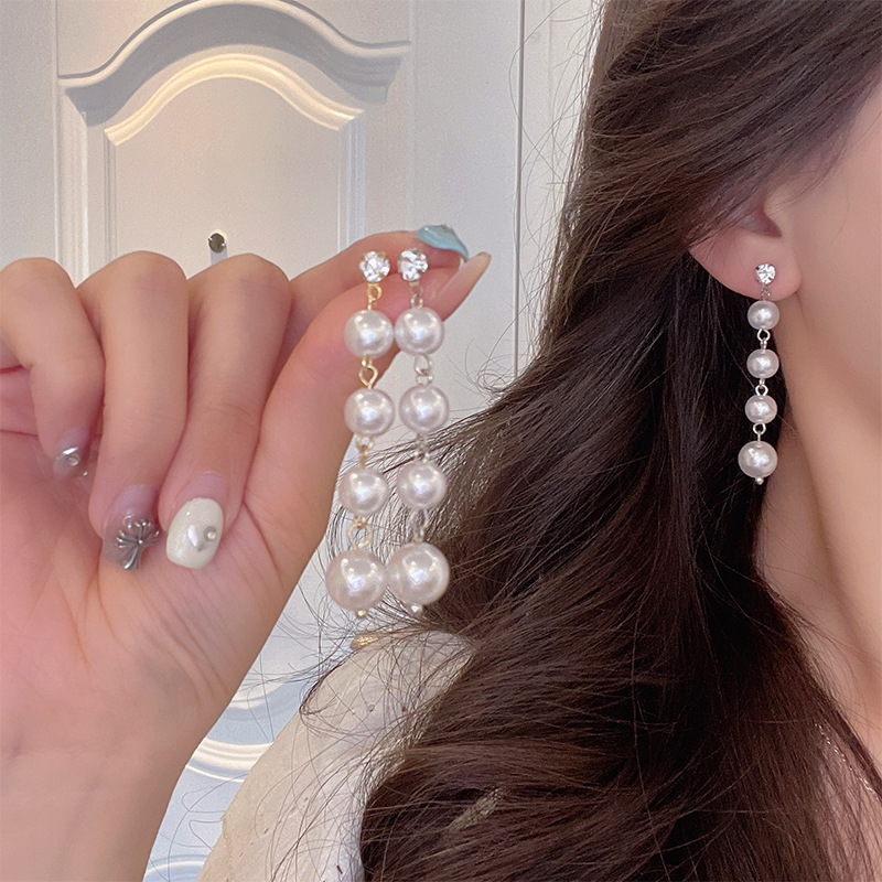 Long pearl stud earrings, exaggerated tassel earrings with a European and American style, exude a light luxury and high-end charm, and are popular earrings on the Internet details Picture